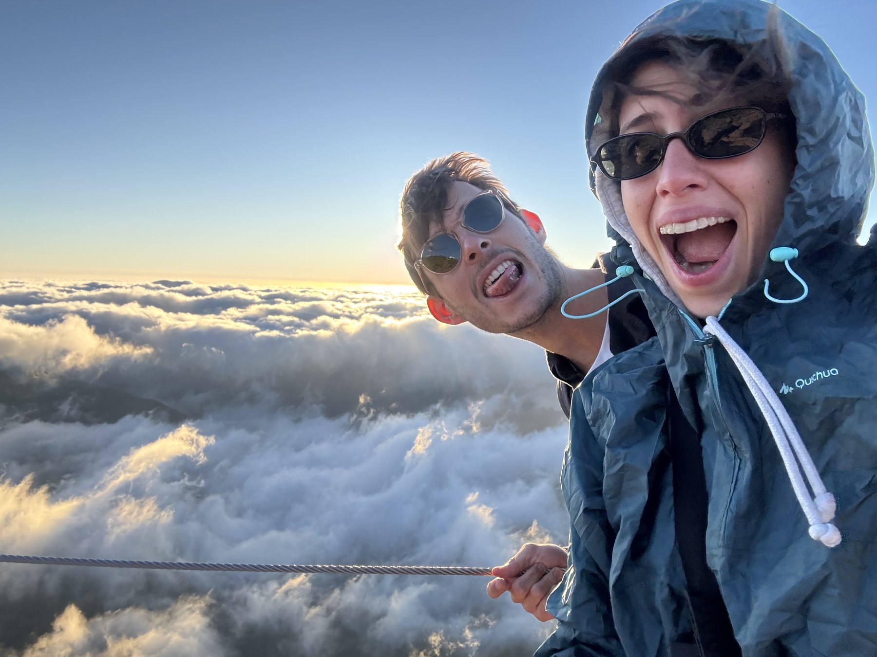 Giuliana and Arthur above the clouds at sunset